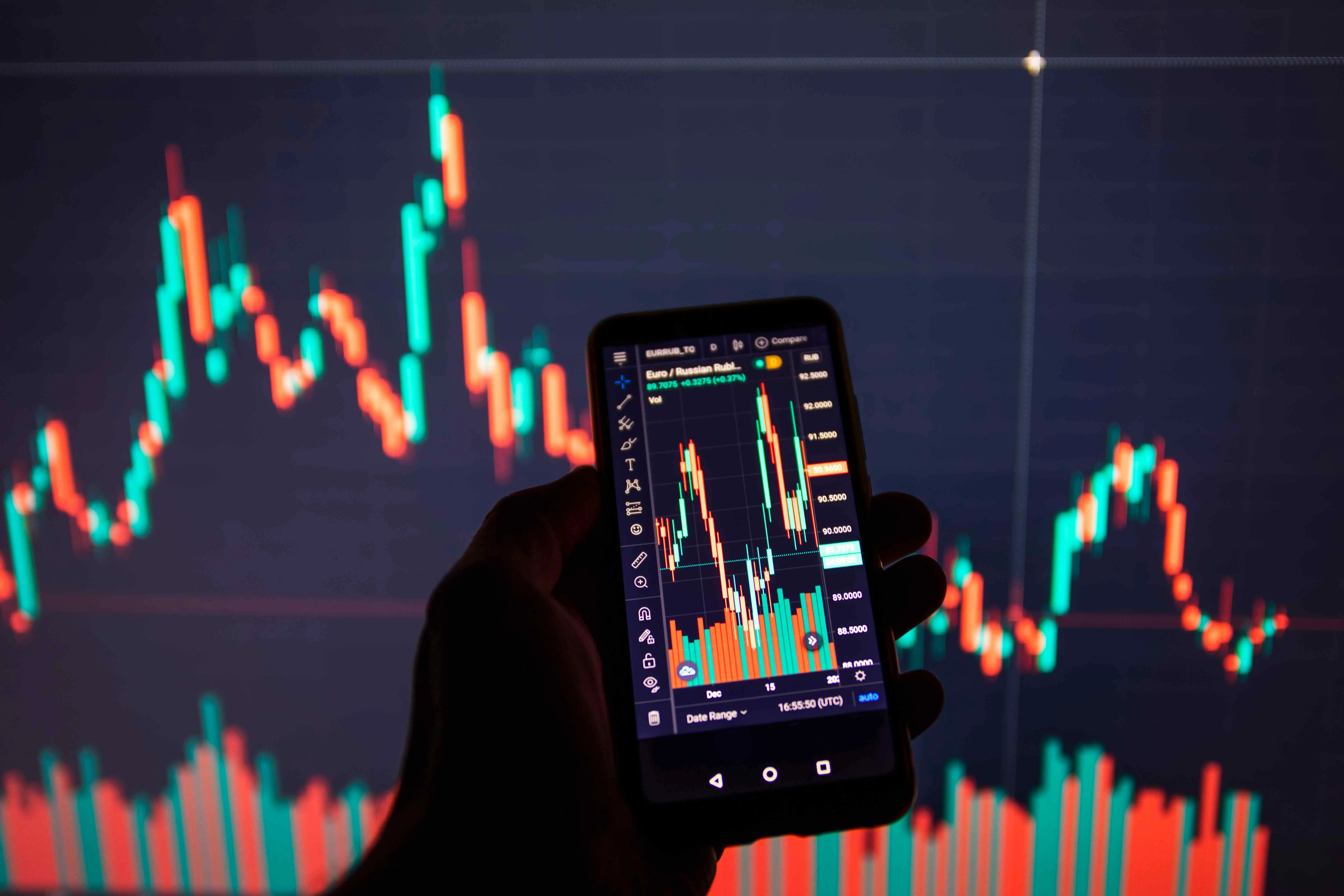 businessman-using-a-mobile-device-to-check-market-2021-08-31-09-42-03-utc.webp